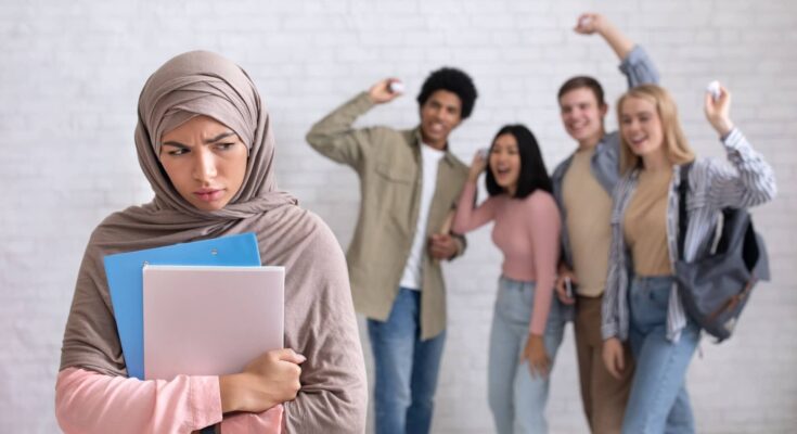 peer-problems-victim-racism-humiliation-and-bullying-in-college-or-picture-id1300322821-1-1